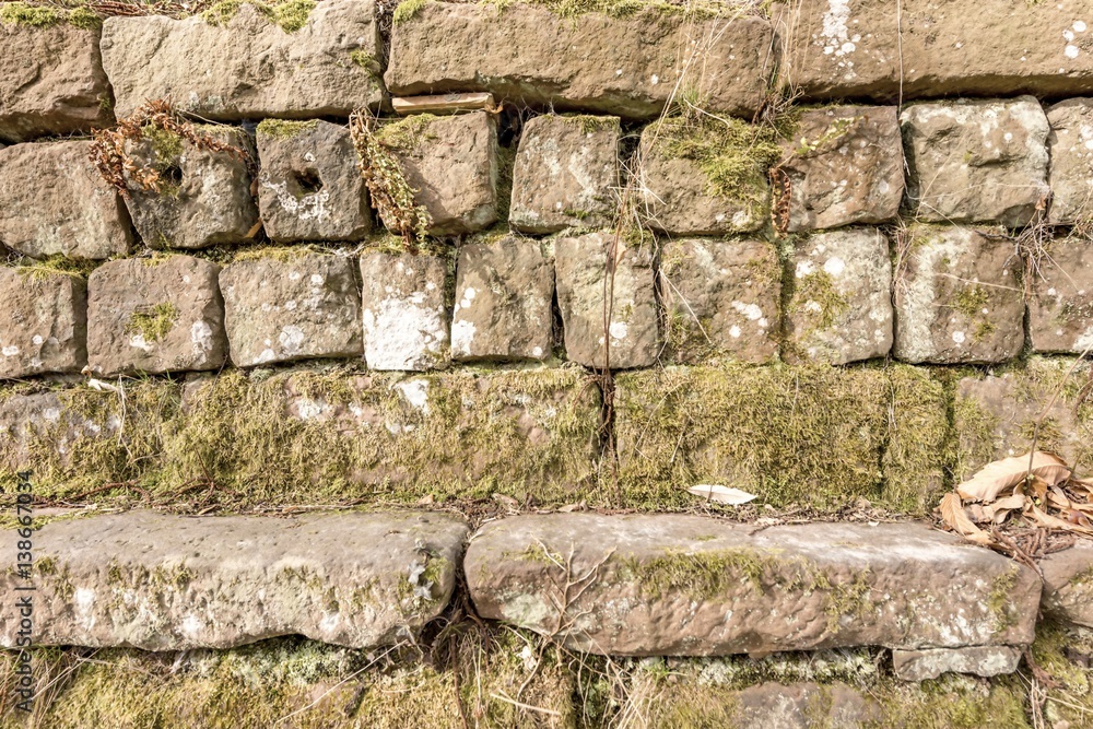 Sandsteinmauer als Hintergrund StockFoto Adobe Stock