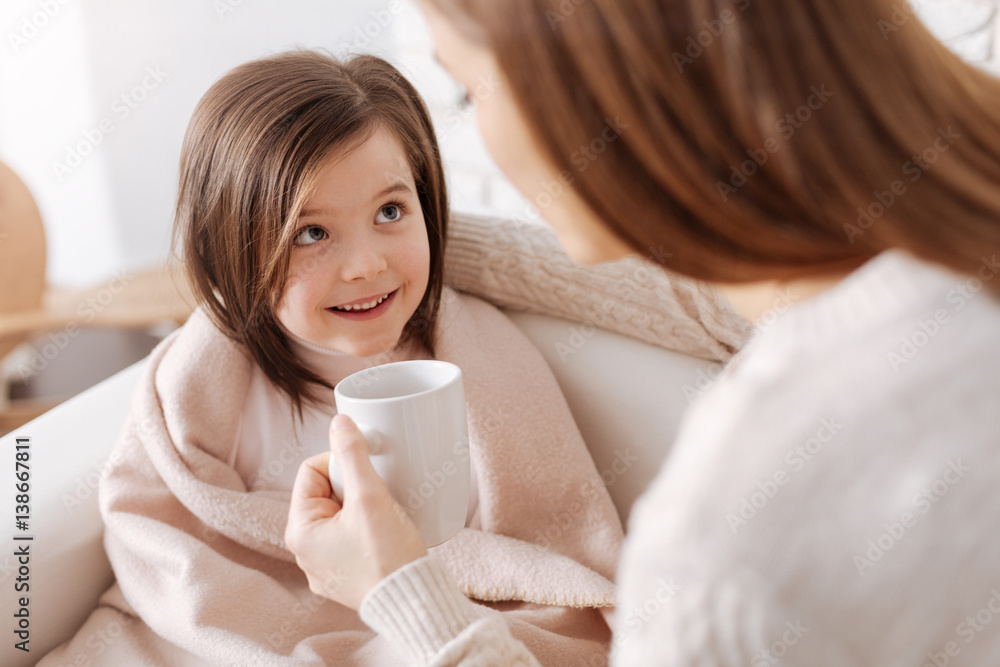 Cheerful little girl recovering from flu Cheerful little girl recovering from flu