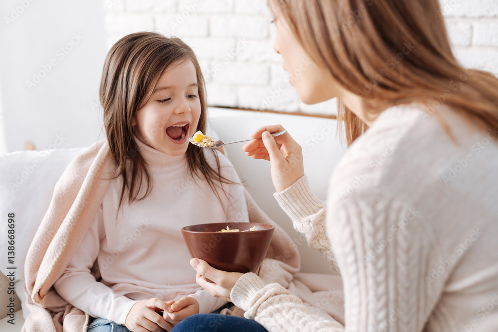 Positive little girl having breakfast Positive little girl having breakfast