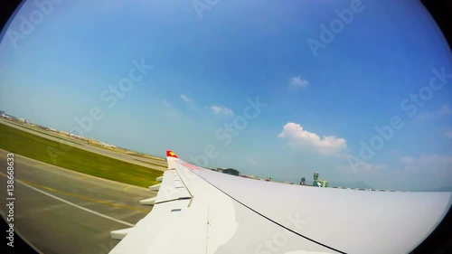 Aircraft take off in the Asian tropical country. Tourists go on vacation to a resort photo