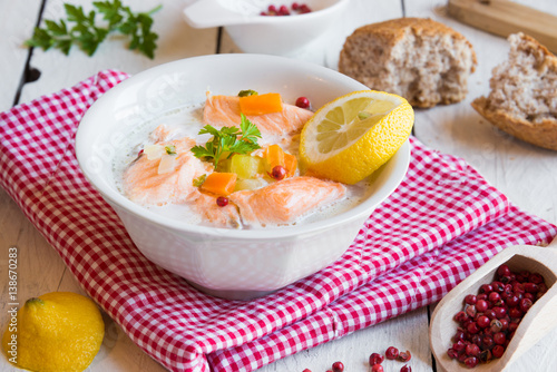 Salmon fish soup with cream and lemon