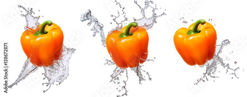 Fototapeta Naklejka Na Ścianę i Meble -  Water splash and vegetables isolated on white backgroud. Fresh bell pepper
