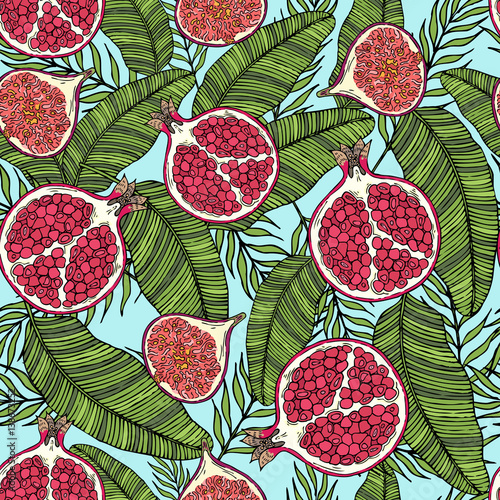 Pattern of fruits pomegranate and fig on the color of leaves. On a blue background.