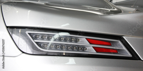 Car headlights. Luxury Headlights. Car. Supercar.  © Stasiuk