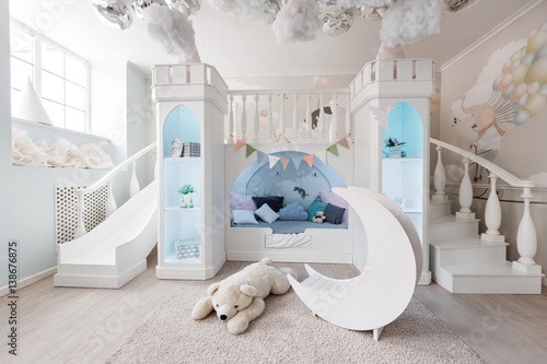 interer of a spacious blue children's room. decorative castle game photo