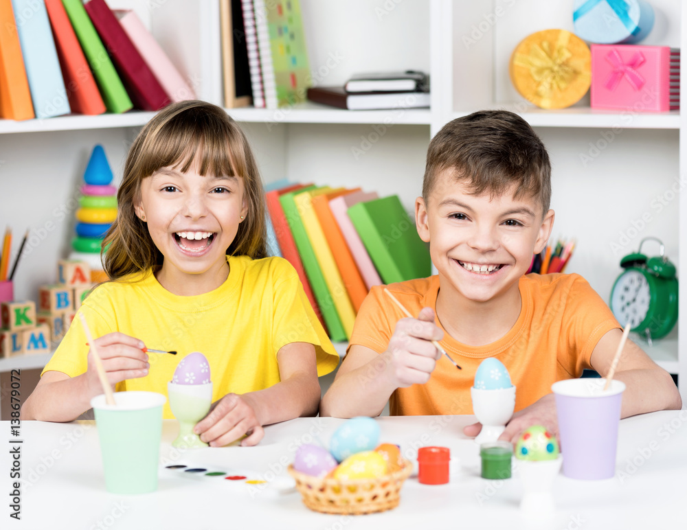 Fototapeta premium Easter holiday - kid coloring eggs