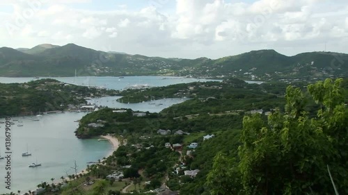 Pan over English Harbour, Antigua from Shirley Heights. Many yachts are at anchor photo