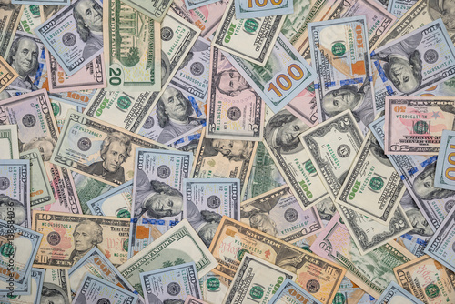 pile of one hundred,fifty and twenty dollar bills