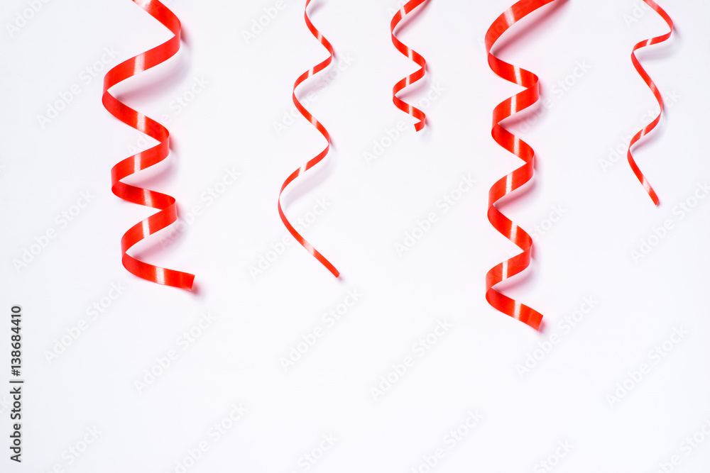 Festive red ribbon isolated on white background Festive red ribbon isolated on white background