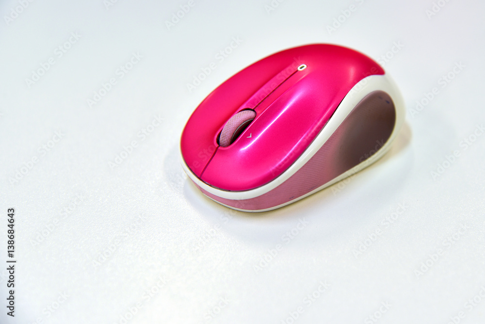 A wireless shocking pink color computer mouse A wireless shocking pink color computer mouse