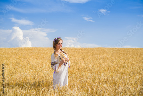 blonde on the field with wheat