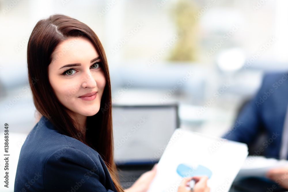 Face of beautiful woman on the background of business people Face of beautiful woman on the background of business people