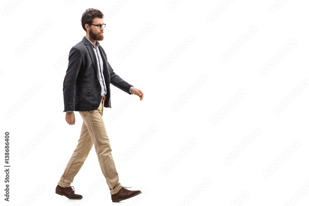 Young bearded man walking