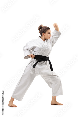 Girl wearing a kimono practicing karate