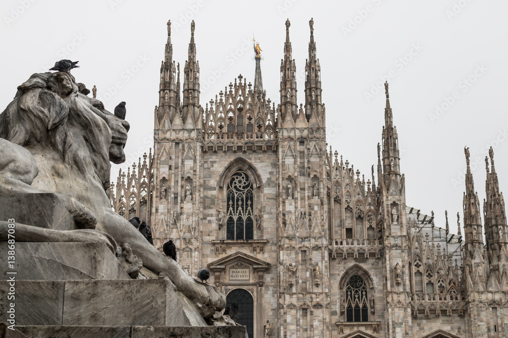 Milan (Milano), Italy - February 17, 2017: Duomo di Milano (Cathedral) and lion monument