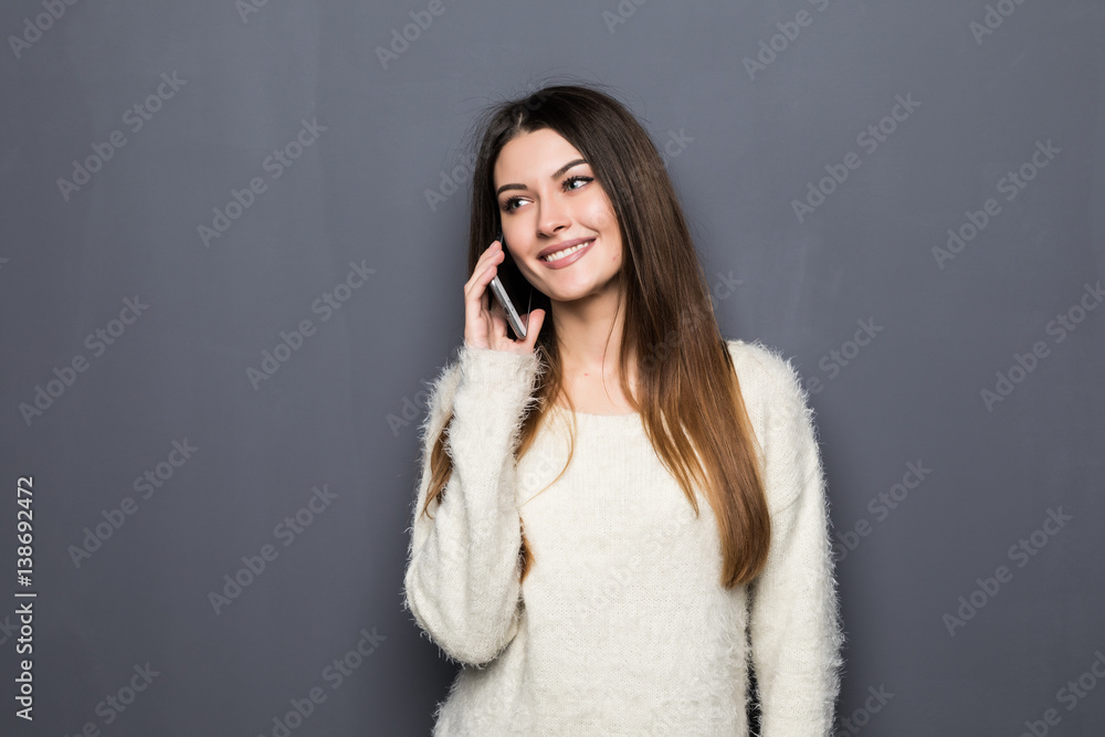 Cheerful young woman talking on mobile phone Cheerful young woman talking on mobile phone