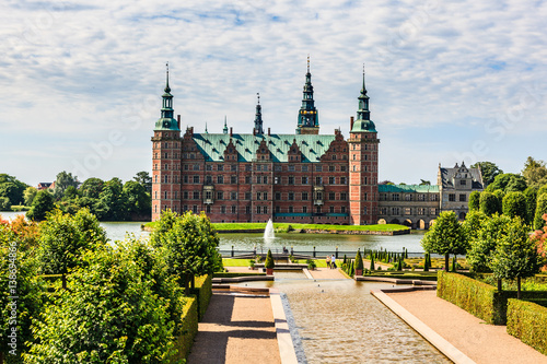 The majestic castle Frederiksborg Castle seen from the beautiful park area