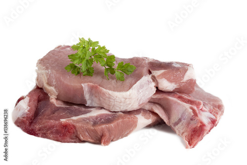Many fresh porc chops or cutlets with parsley