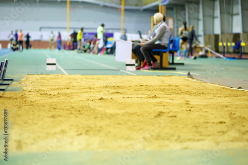 Sandpit for long jump on indoor track and filed competition photo