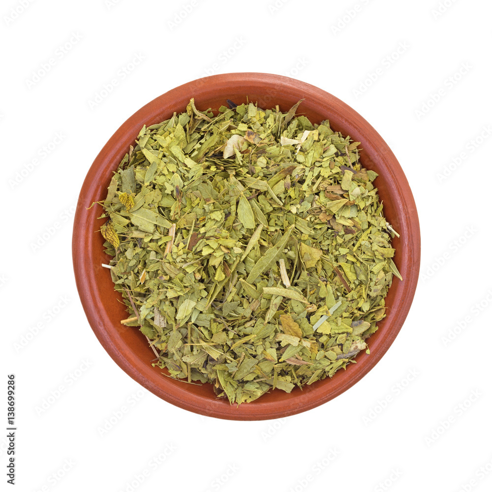 Top view of a bowl filled with cut and sifted senna leaf isolated on a white background. Top view of a bowl filled with cut and sifted senna leaf isolated on a white background.