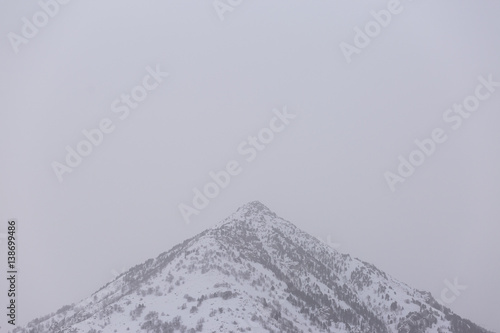Winter landscape. Top of the mountain witg fog