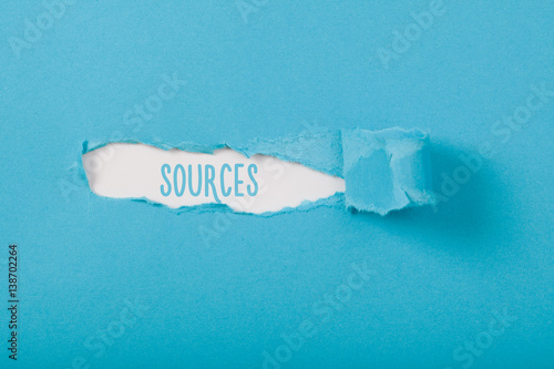 Sources message on Paper torn ripped opening