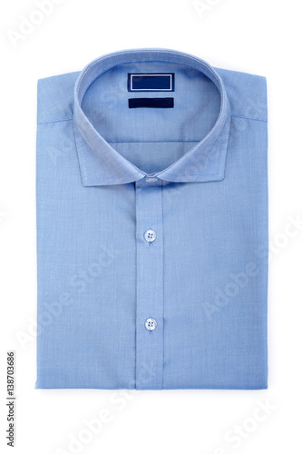 Men's classic blue folded cotton shirt with long or short sleeve and blue blank label isolated on white background.