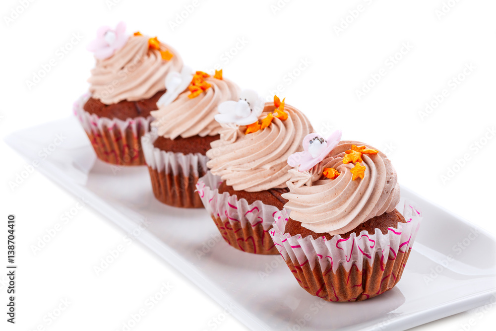 Several fresh muffins on a platter Several fresh muffins on a platter