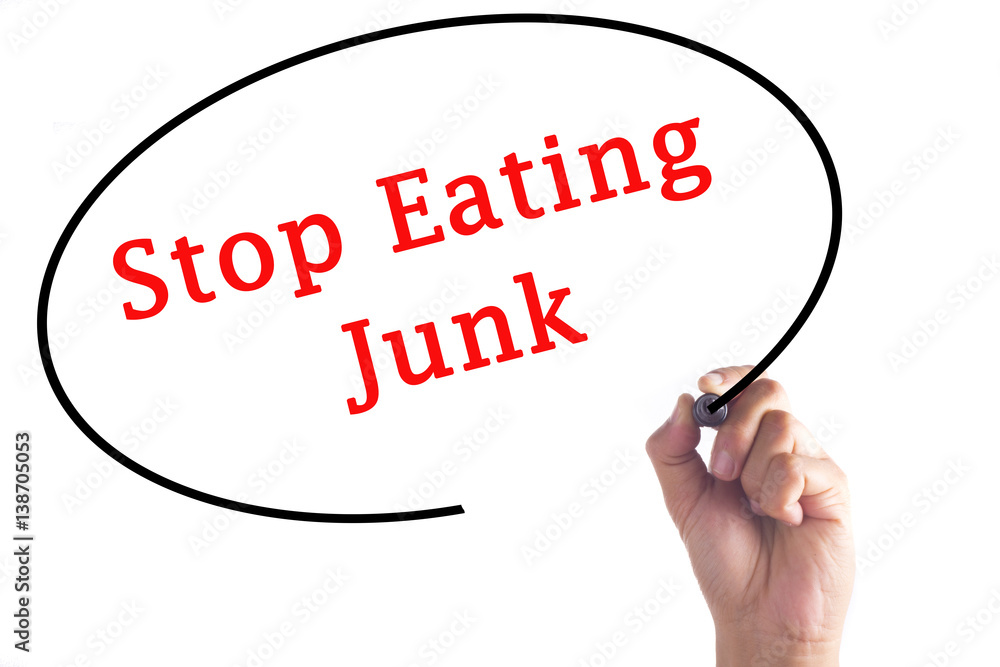 Hand writing Stop Eating Junk on transparent board Hand writing Stop Eating Junk on transparent board