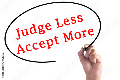 Hand writing Judge Less Accept More on transparent board