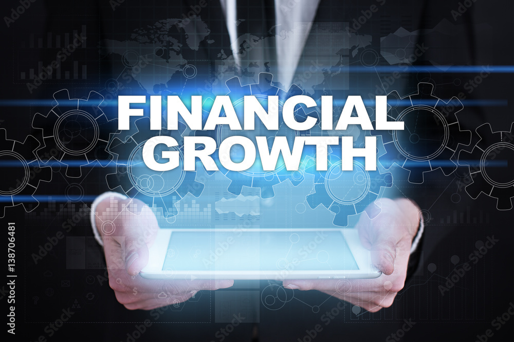 Businessman holding tablet PC with financial growth concept. Businessman holding tablet PC with financial growth concept.