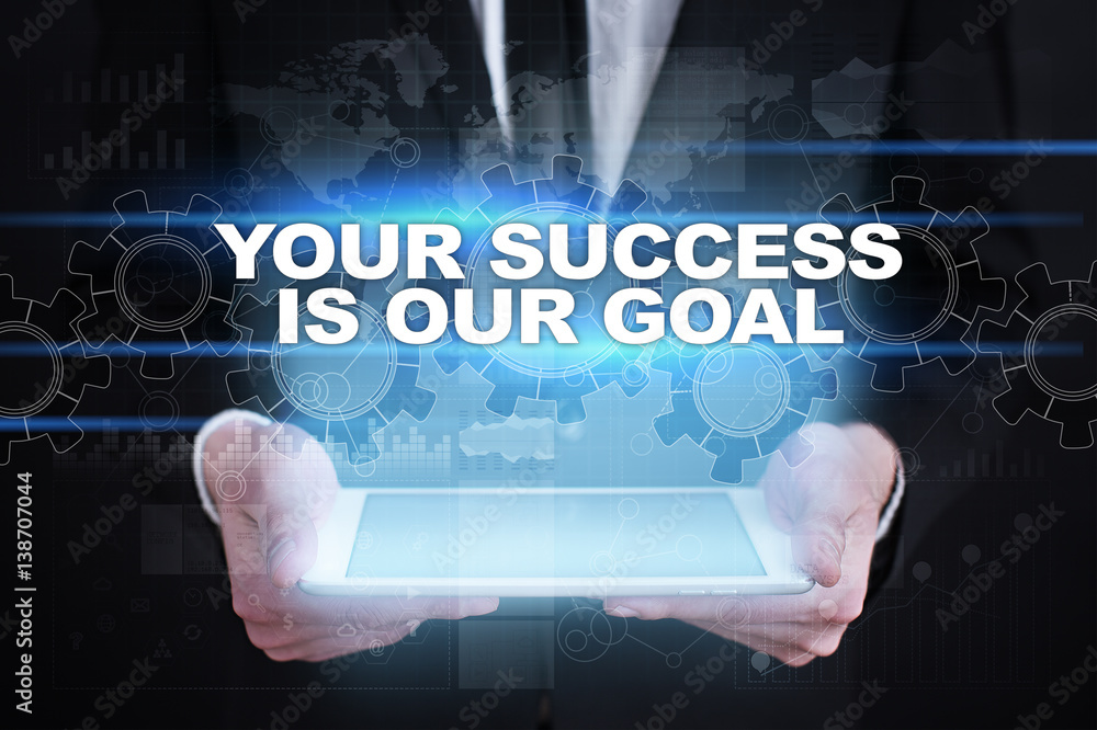 Businessman holding tablet PC with your success is our goal concept. Businessman holding tablet PC with your success is our goal concept.