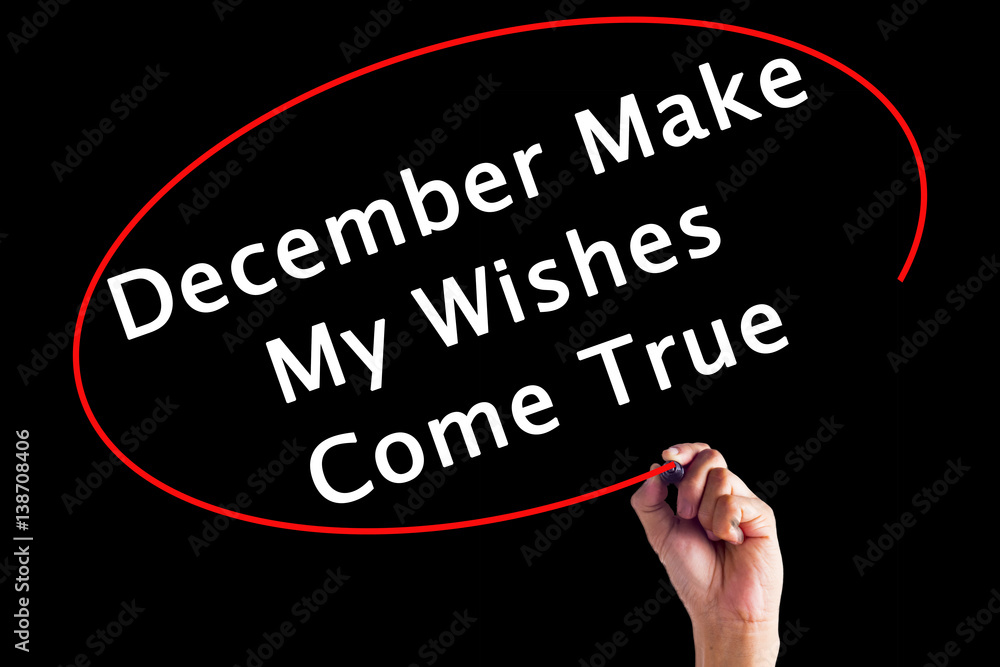 Hand Writing December Make My Wishes Come True with a marker over transparent board. Hand Writing December Make My Wishes Come True with a marker over transparent board.