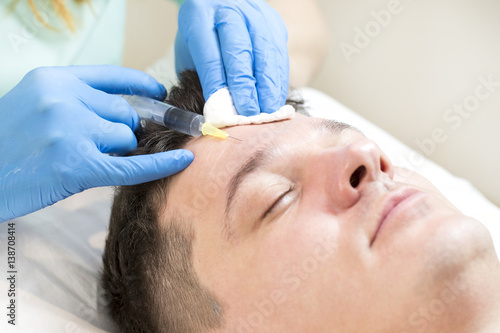 Man passes a course of mesotherapy clinic 