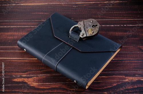 leather organizer with old padlock