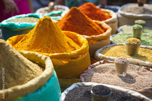 Colorful spices powders and herbs in traditional street market in Delhi. India.