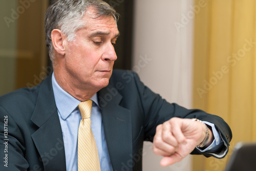 Businessman taking a look at his watch