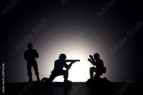 Silhouette of soldiers on a dark background