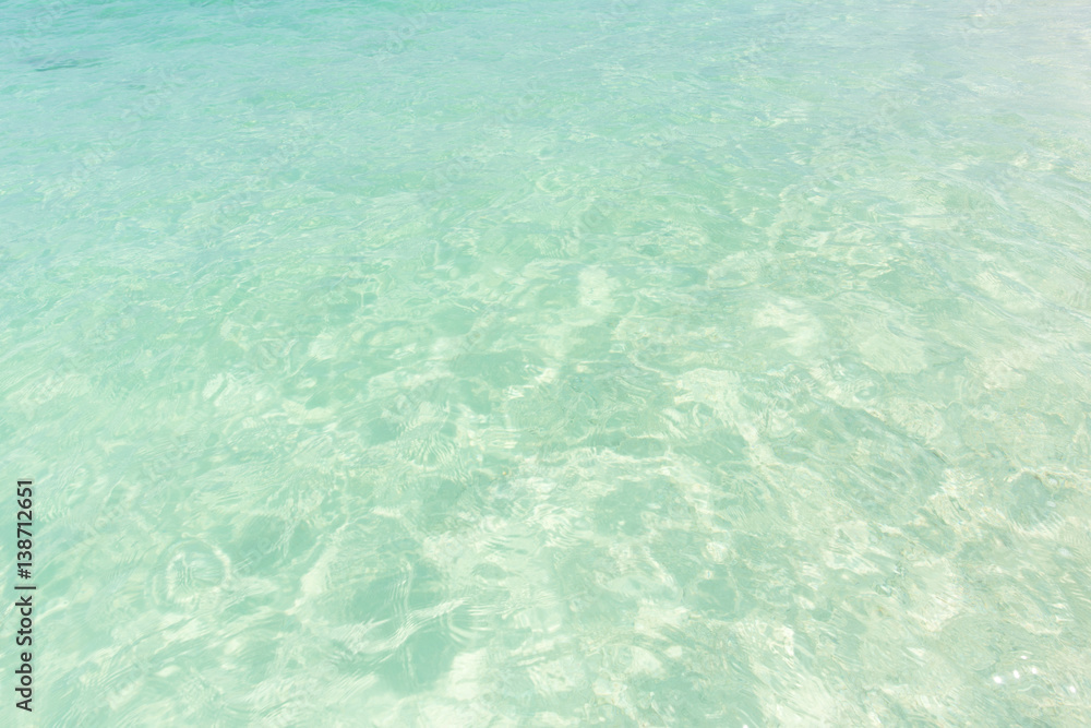 Ocean water background, clean and clear blue emerald sea beach.