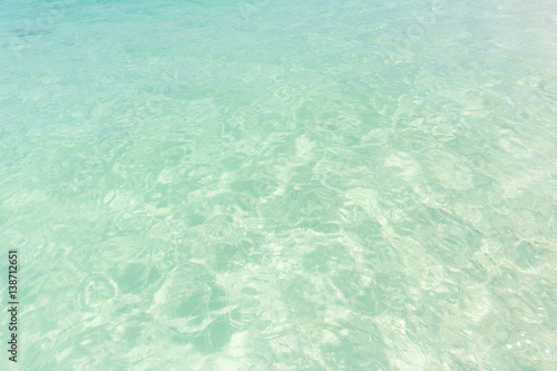 Ocean water background, clean and clear blue emerald sea beach.