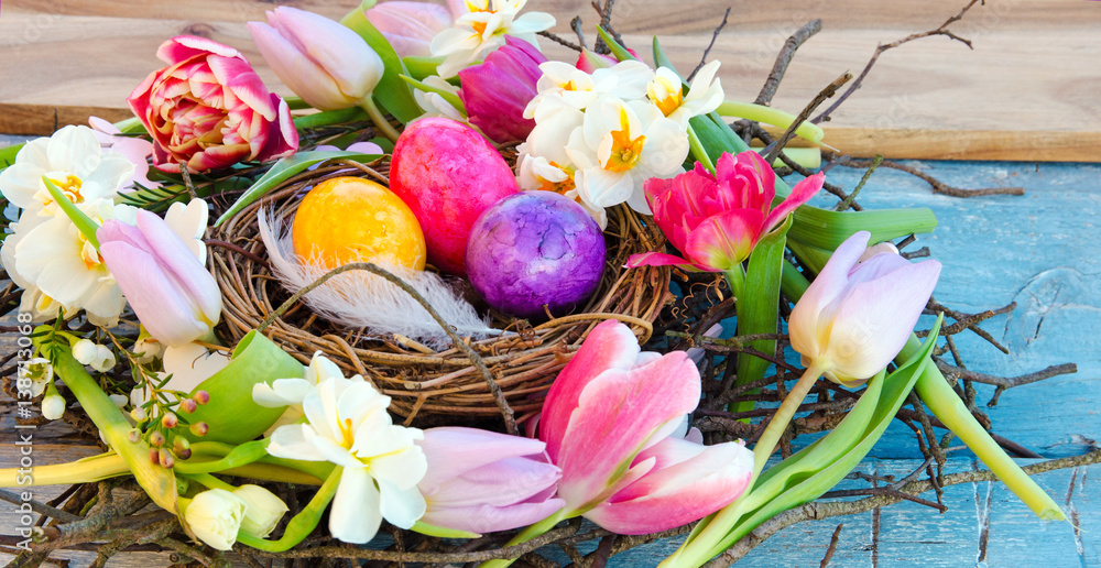 Fototapeta premium Happy Easter: nest with Easter eggs, feathers, tulips and daffodils:) 