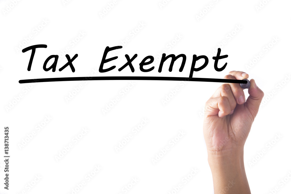 Hand writing Tax Exempt word on transparent board Hand writing Tax Exempt word on transparent board