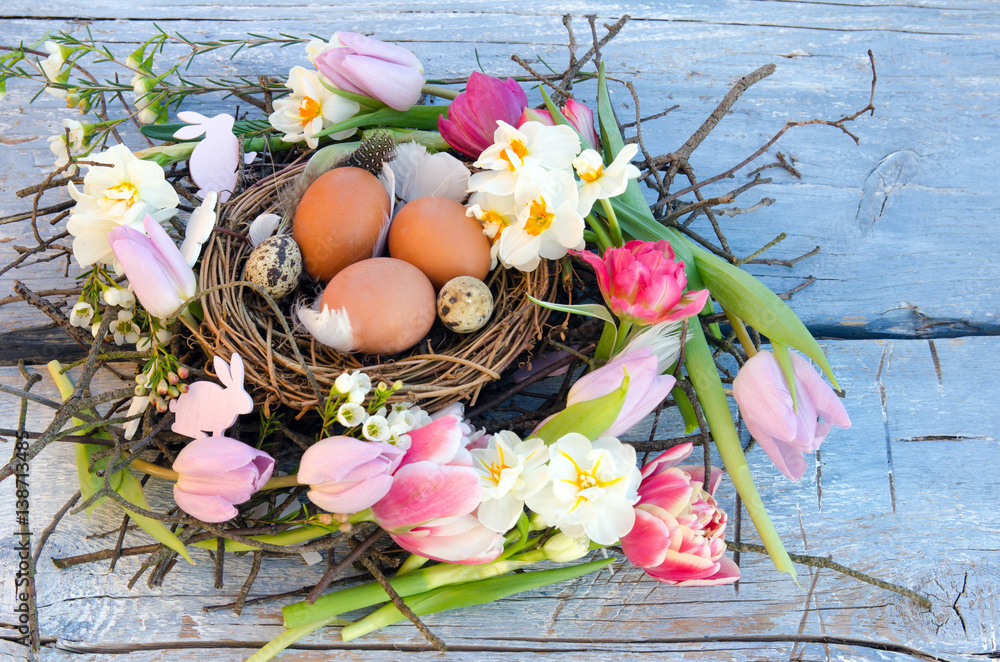 Happy Easter: nest with Easter eggs, feathers, tulips and daffodils:)