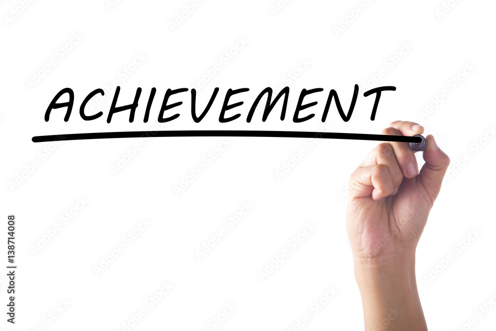 Hand writing ACHIEVEMENT on transparent board Hand writing ACHIEVEMENT on transparent board