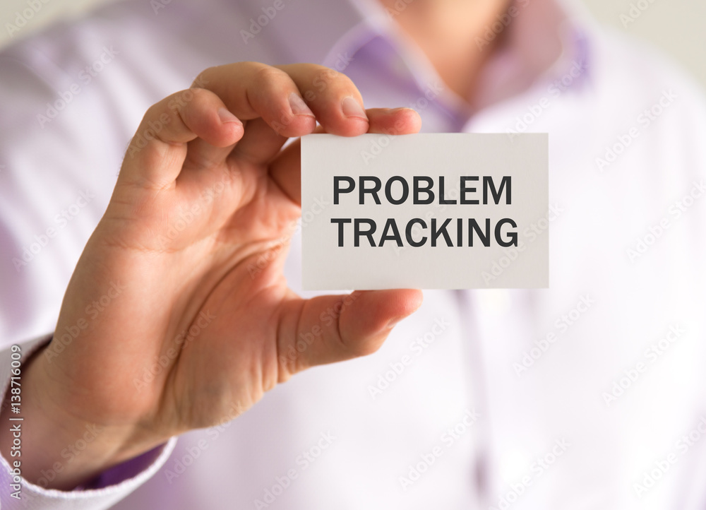Businessman holding a card with PROBLEM TRACKING message Businessman holding a card with PROBLEM TRACKING message