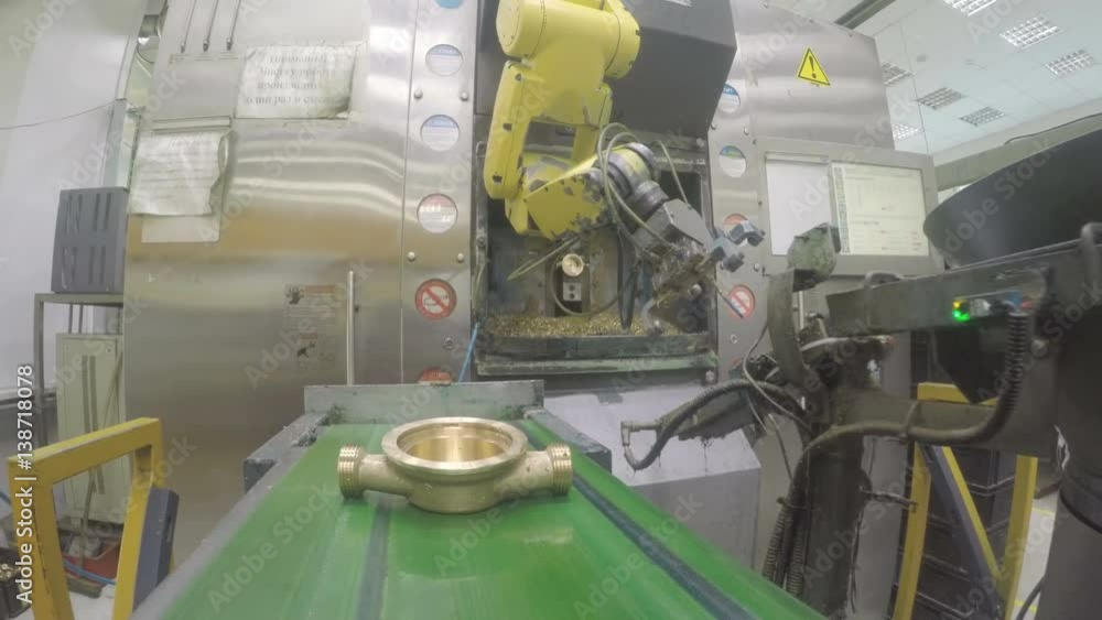 Mechanical Robot Arm Puts Meter Detail on Conveyor Mechanical Robot Arm Puts Meter Detail on Conveyor