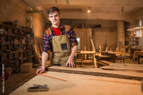 Carpenter is studying,works with the tools without protection
