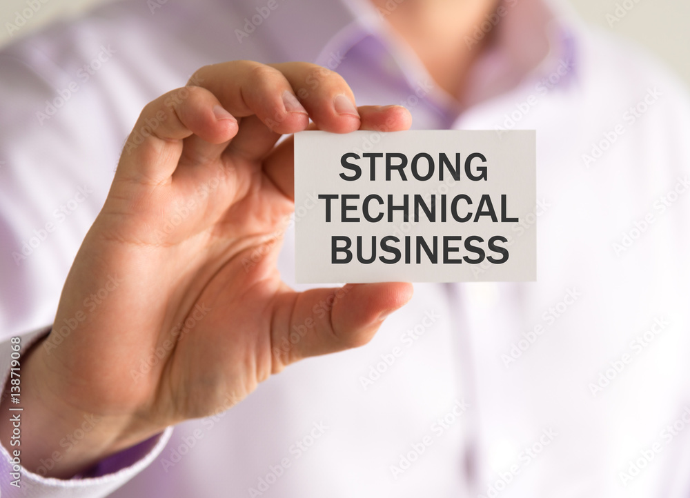 Businessman holding a card with STRONG TECHNICAL BUSINESS message Businessman holding a card with STRONG TECHNICAL BUSINESS message