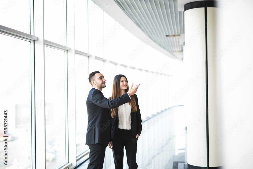 A businessman showing a plan to his colleague in office A businessman showing a plan to his colleague in office