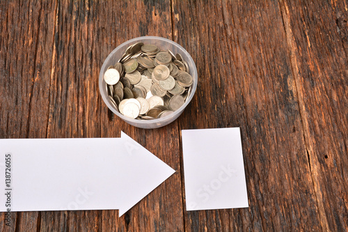 White paper mock up and stack coins in glass for save money and financial, tax season